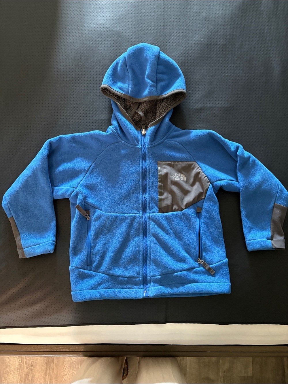 The North Face Kids Blue Hooded Fleece Jacket with Gray Pocket